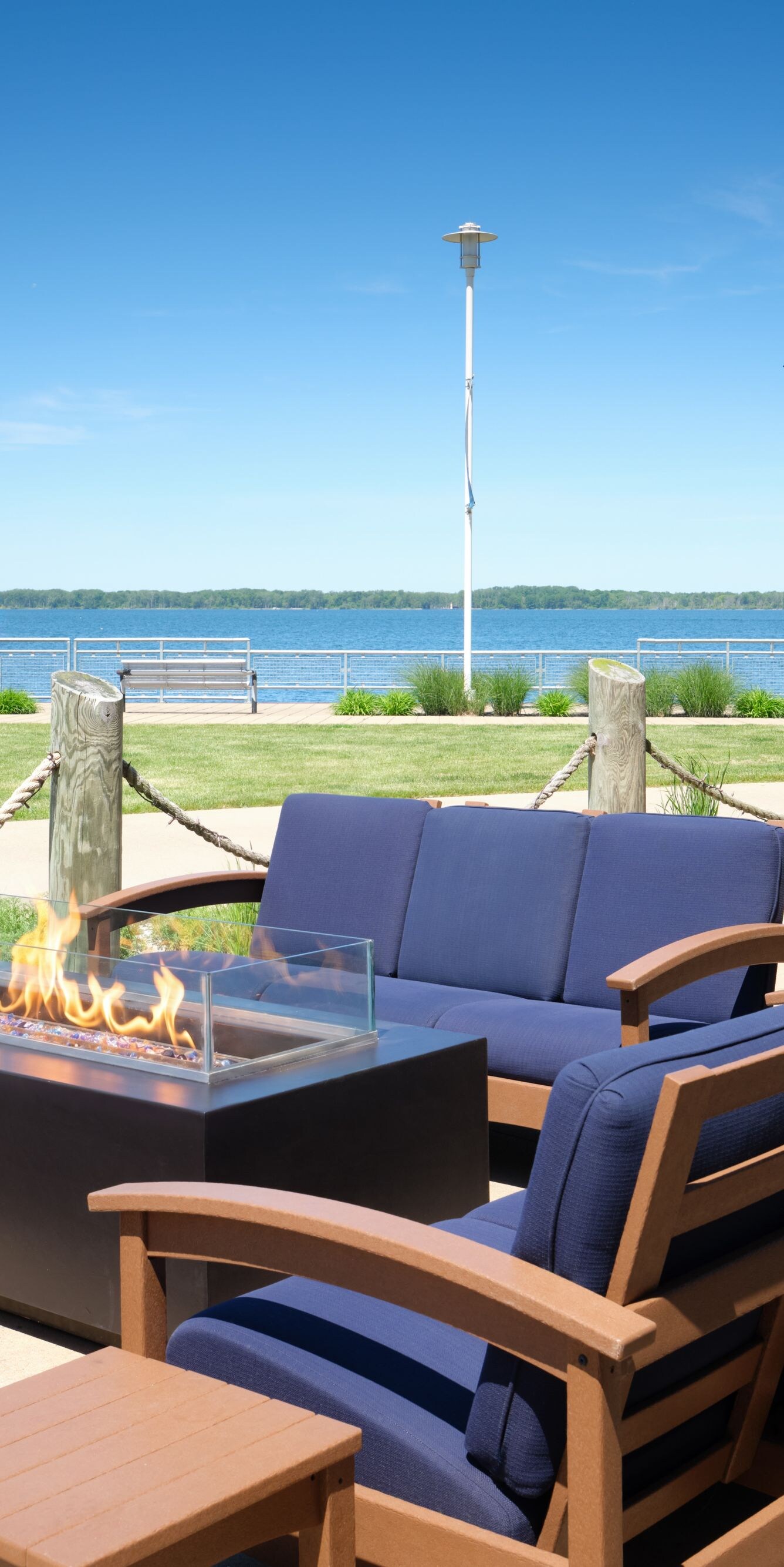 Patio lounge with fire pit and bay view