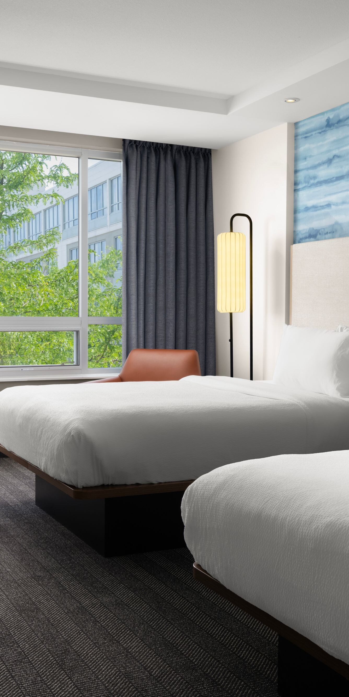 Queen room with tree-lined view