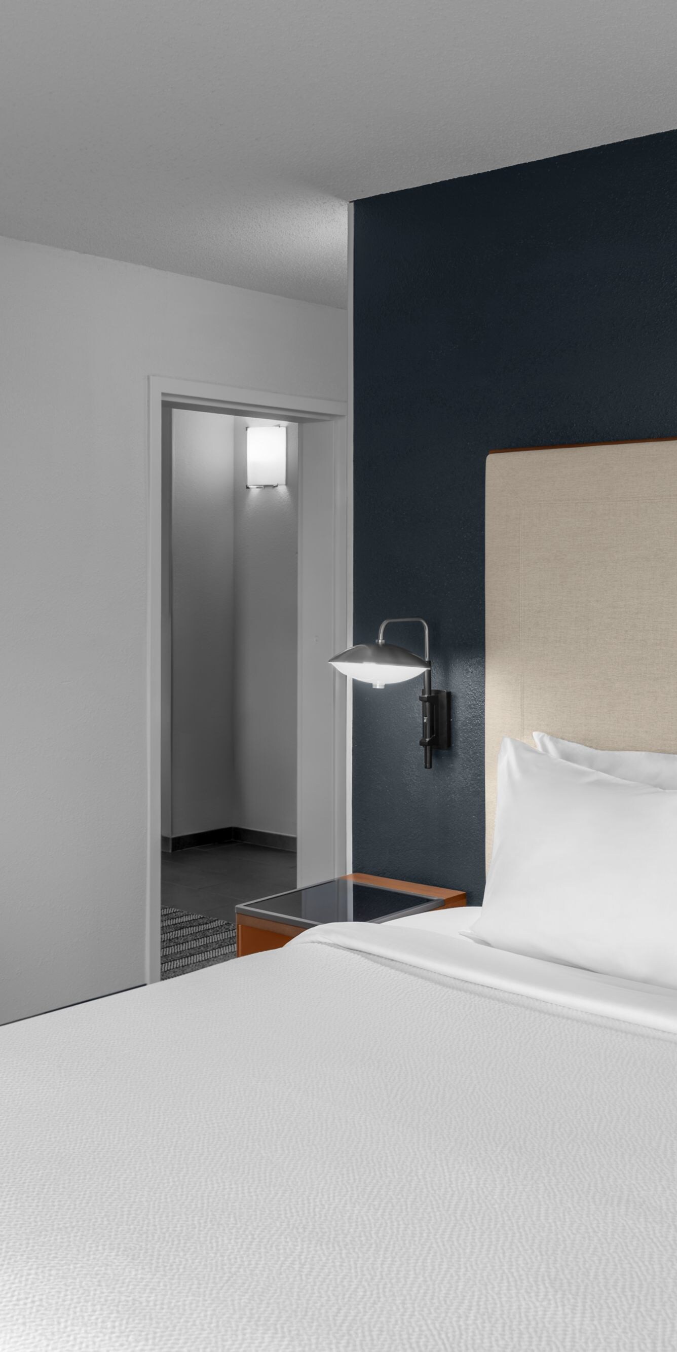 King Suite - Bedroom with dresser and TV