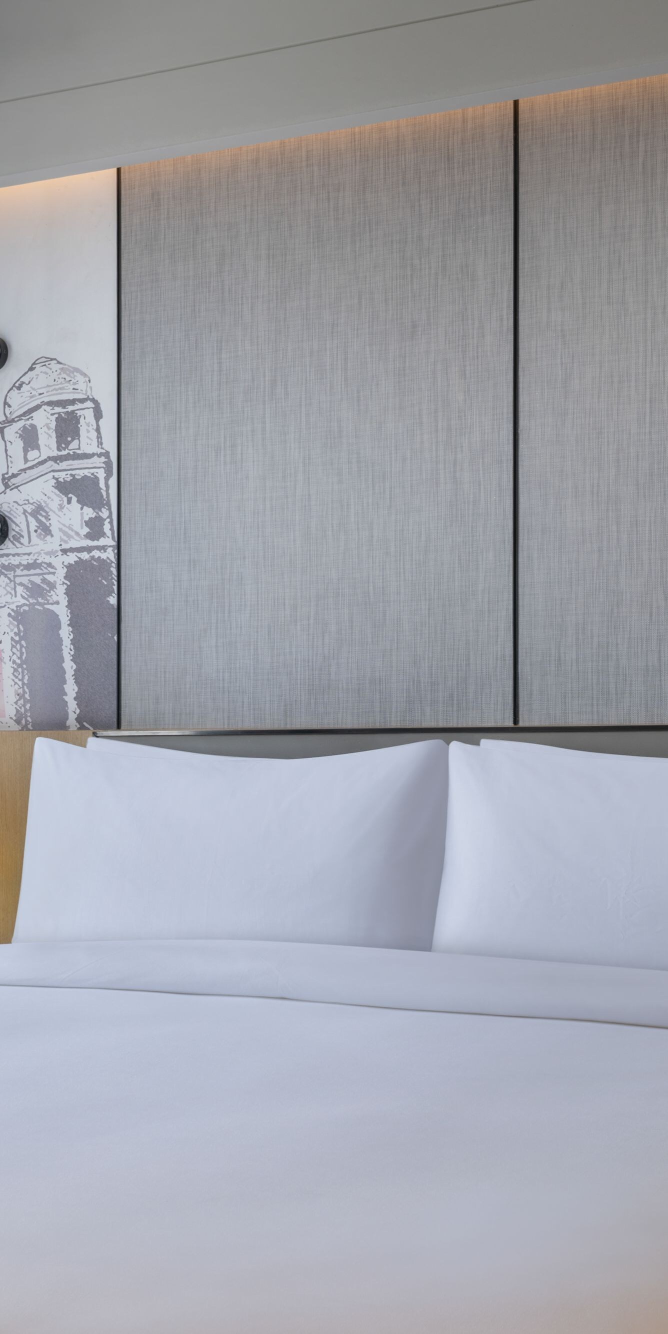 Suite bedroom with a king bed and city view.