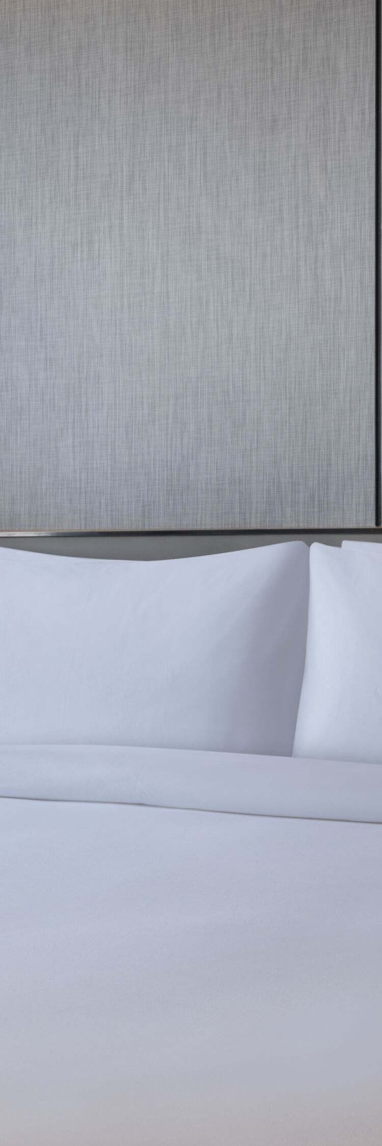 Suite bedroom with a king bed and city view.
