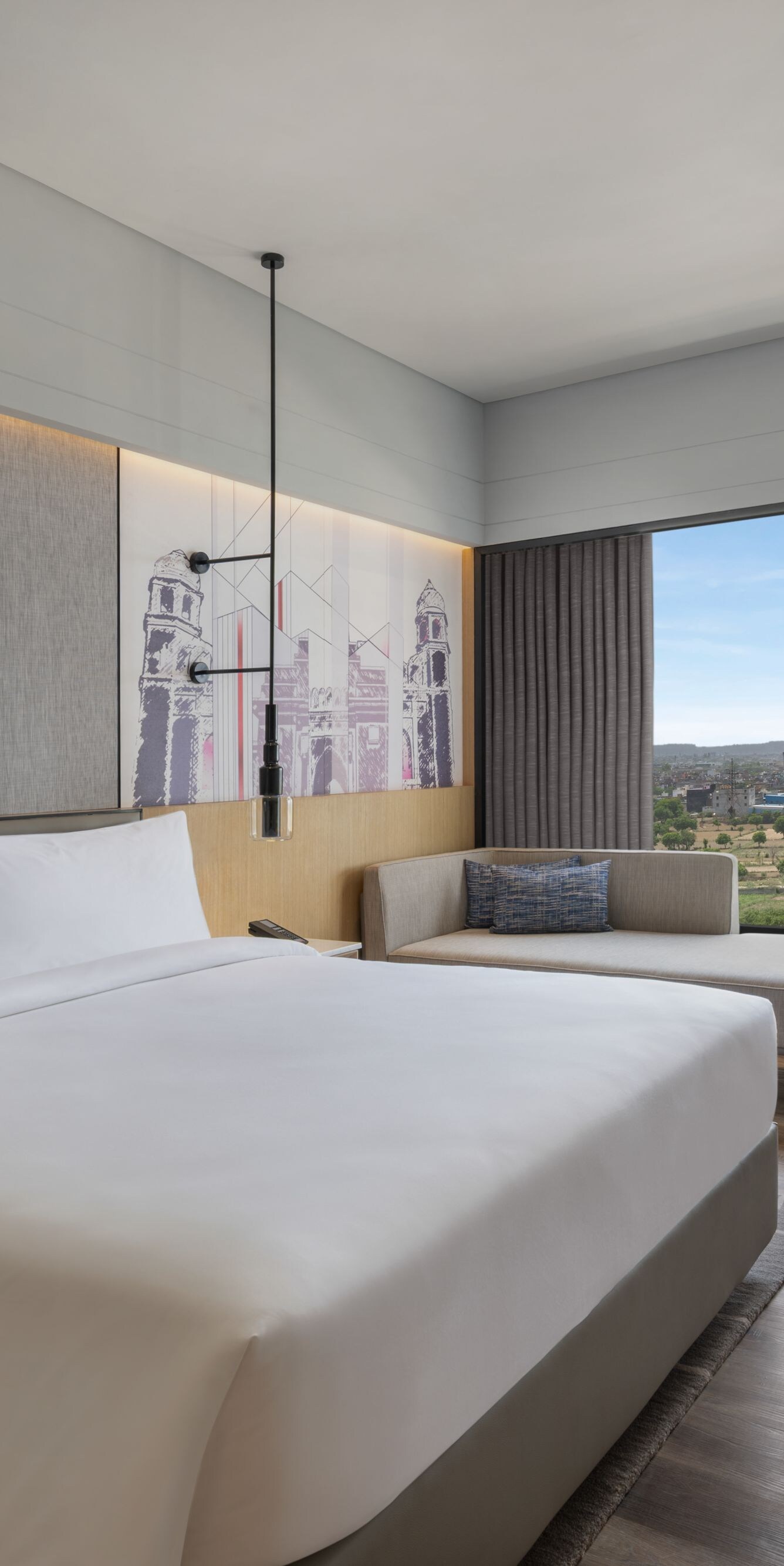 Premier guest room with a king bed and city view.