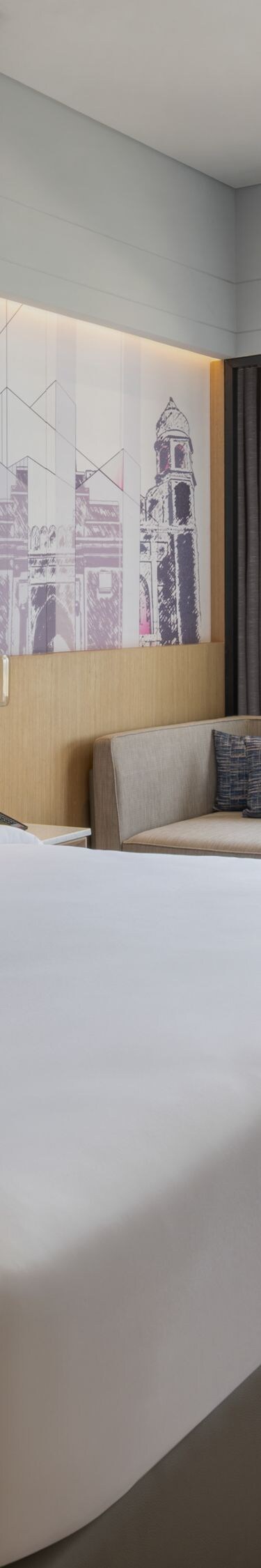 Premier guest room with a king bed and city view.