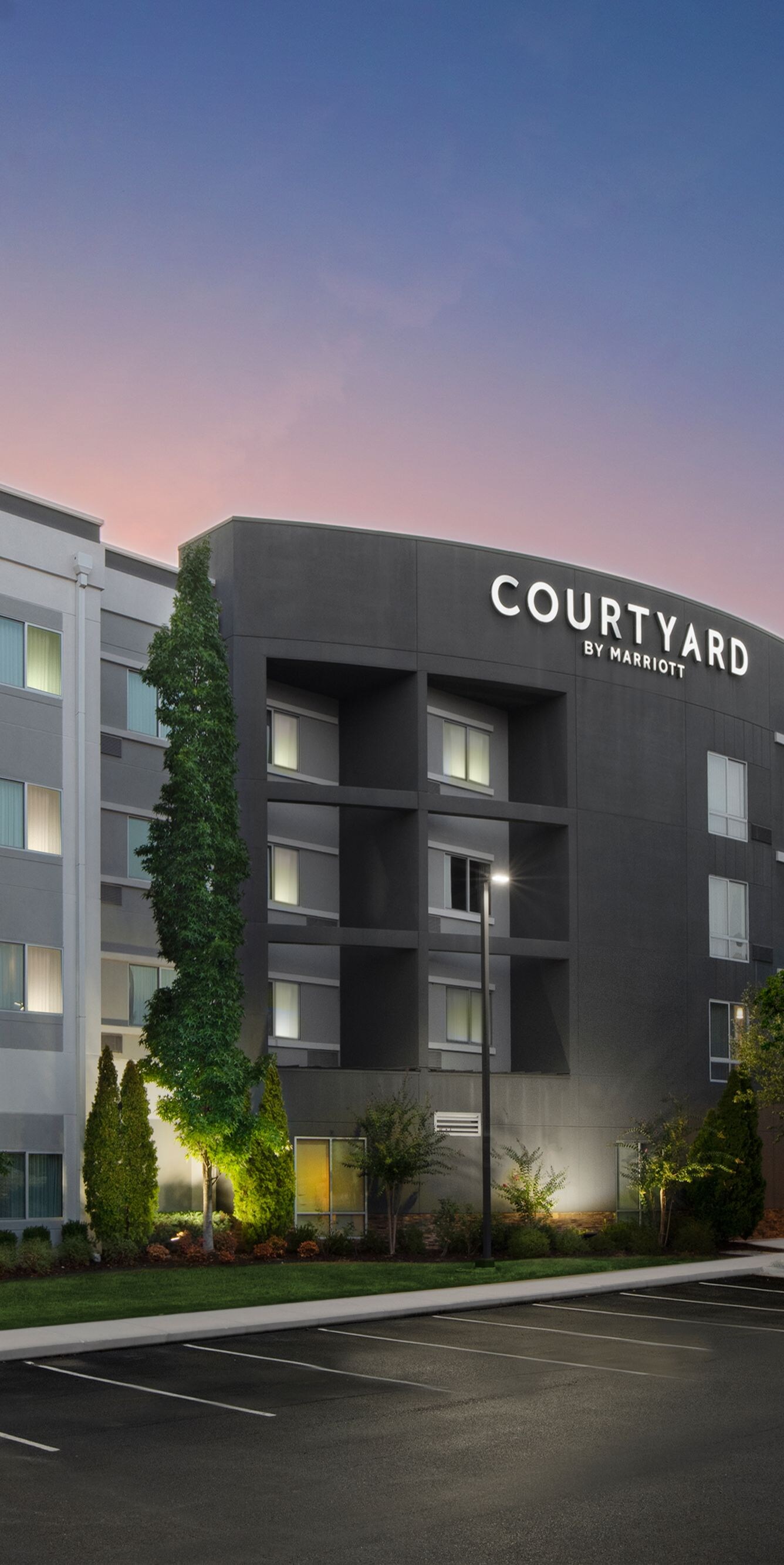 Courtyard hotel exterior at dusk