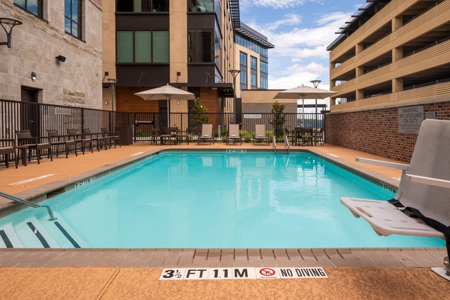 Outdoor swimming pool, handicap accessible lift