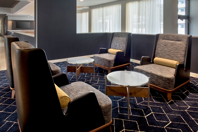 Table and sofa chairs in lobby seating area