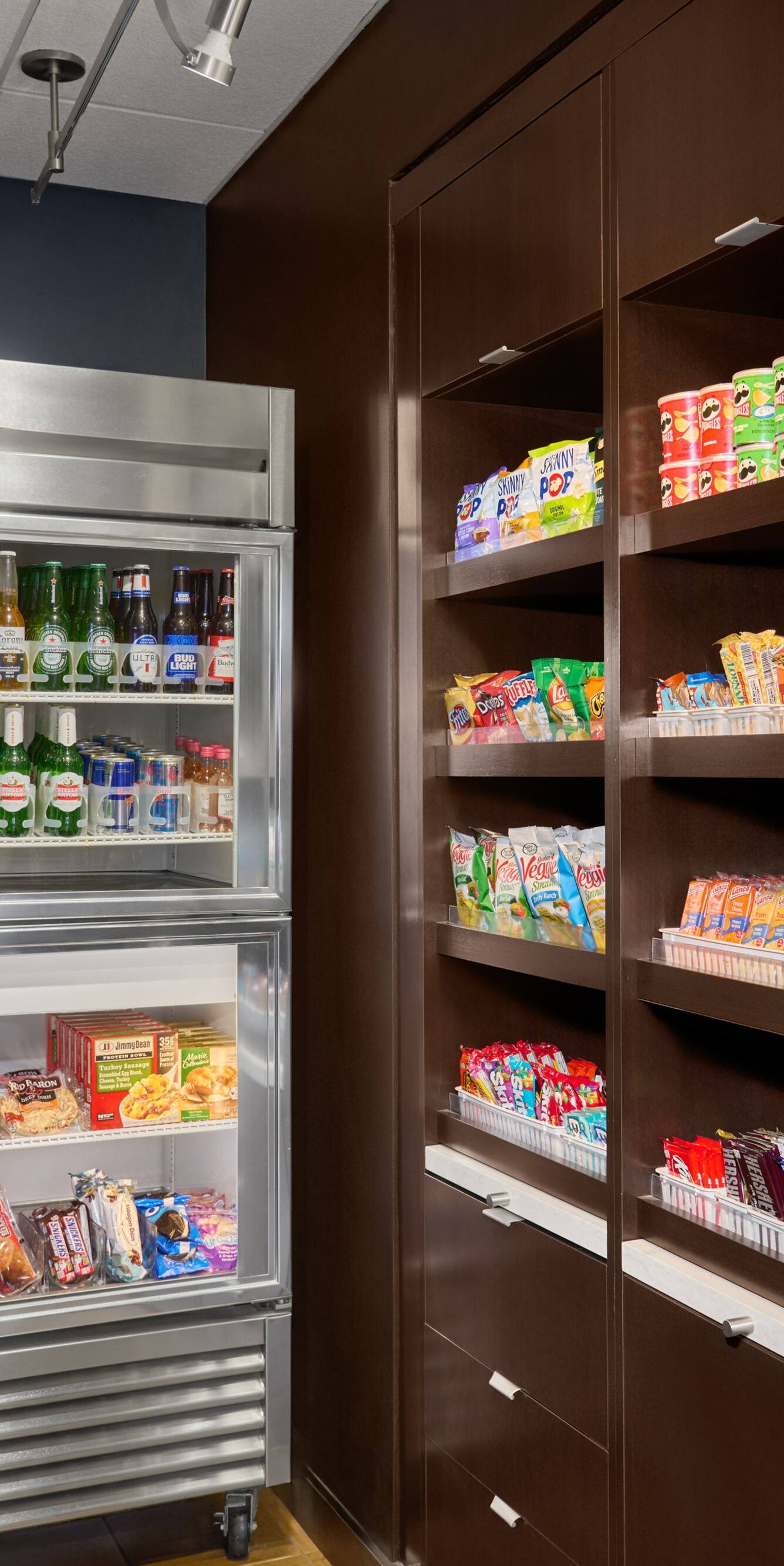 Market with drink coolers and snack shelves