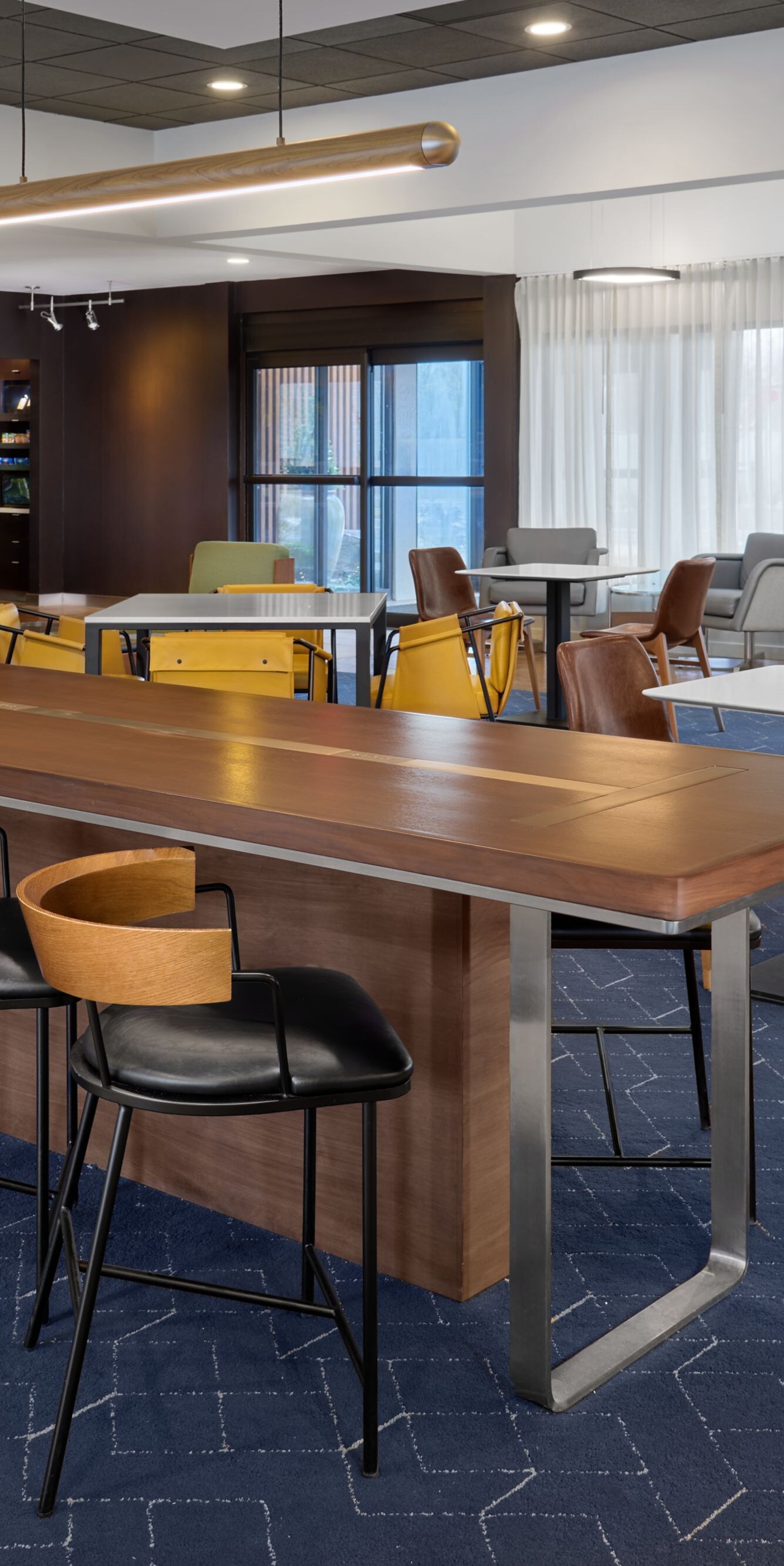 Lobby with tables, chairs, and lounge seating