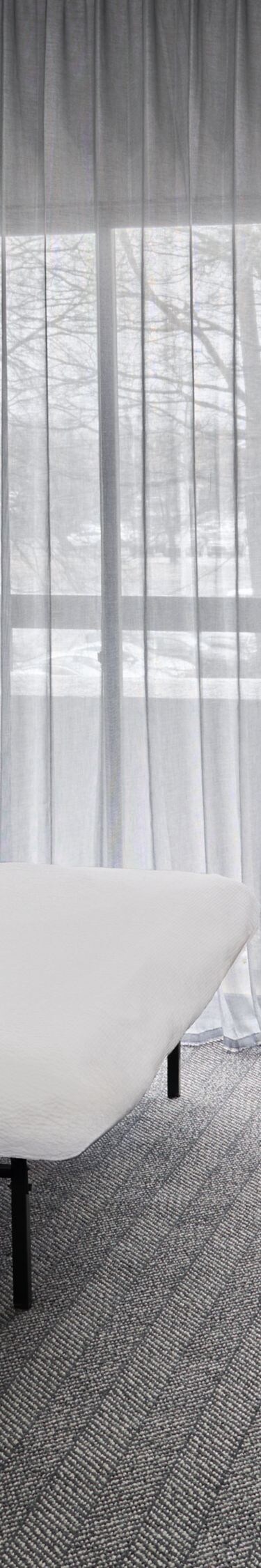 King bed with sofa bed, desk, and balcony view