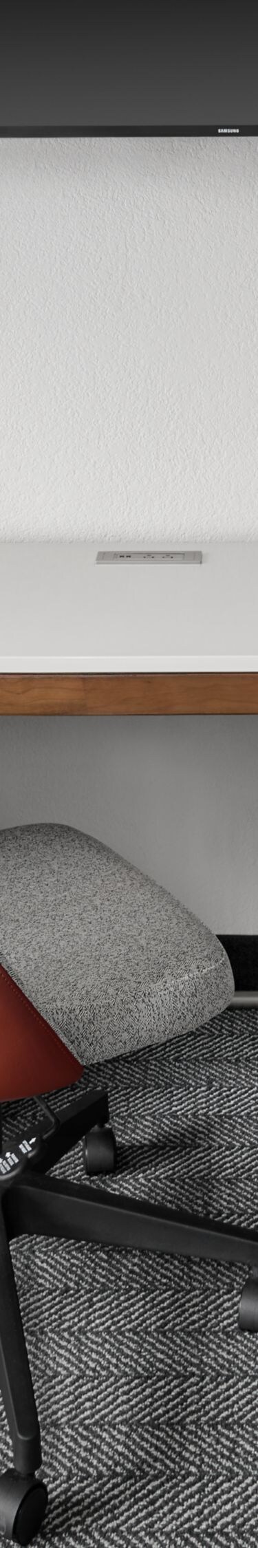 work desk with chair and tv