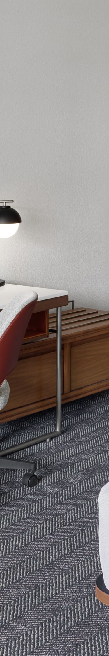 King room with desk, chair, and wall‑mounted TV