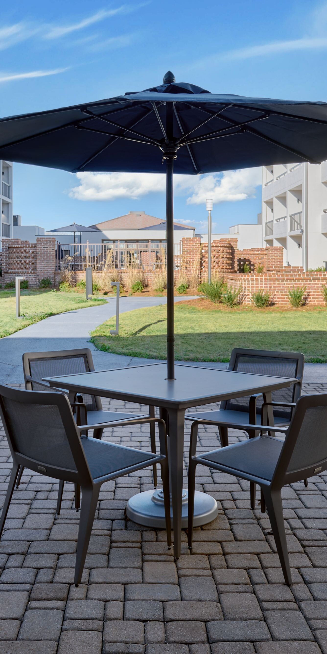 Outdoor Patio with tables, chairs, and umbrellas