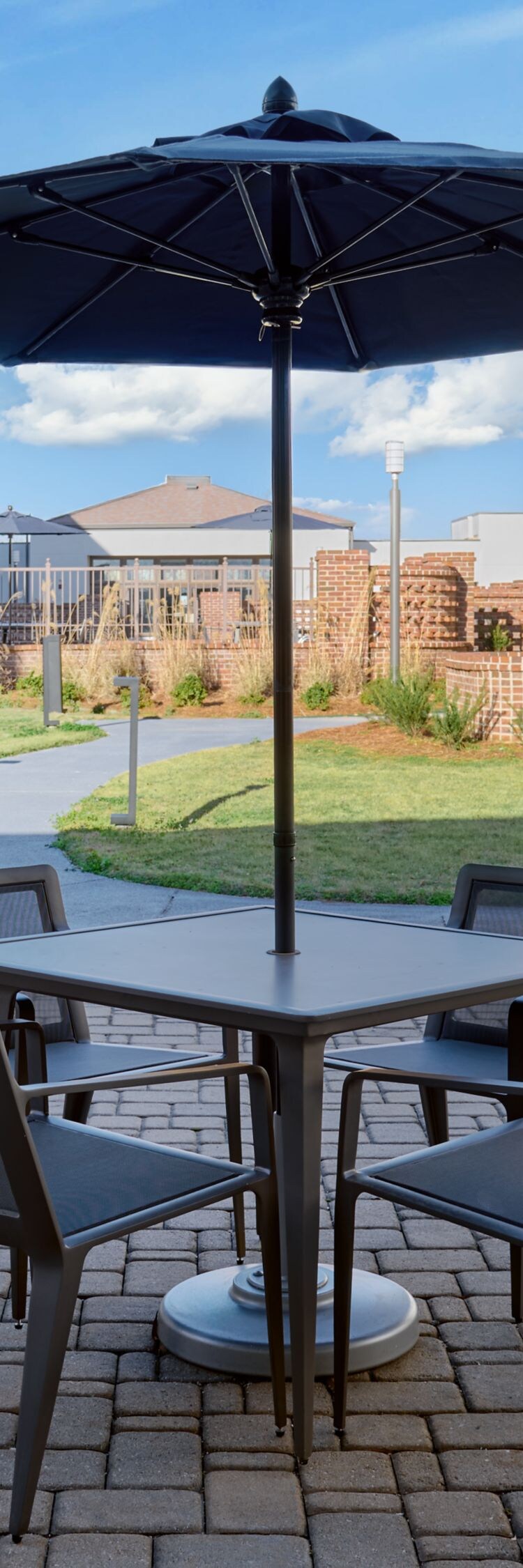 Outdoor Patio with tables, chairs, and umbrellas