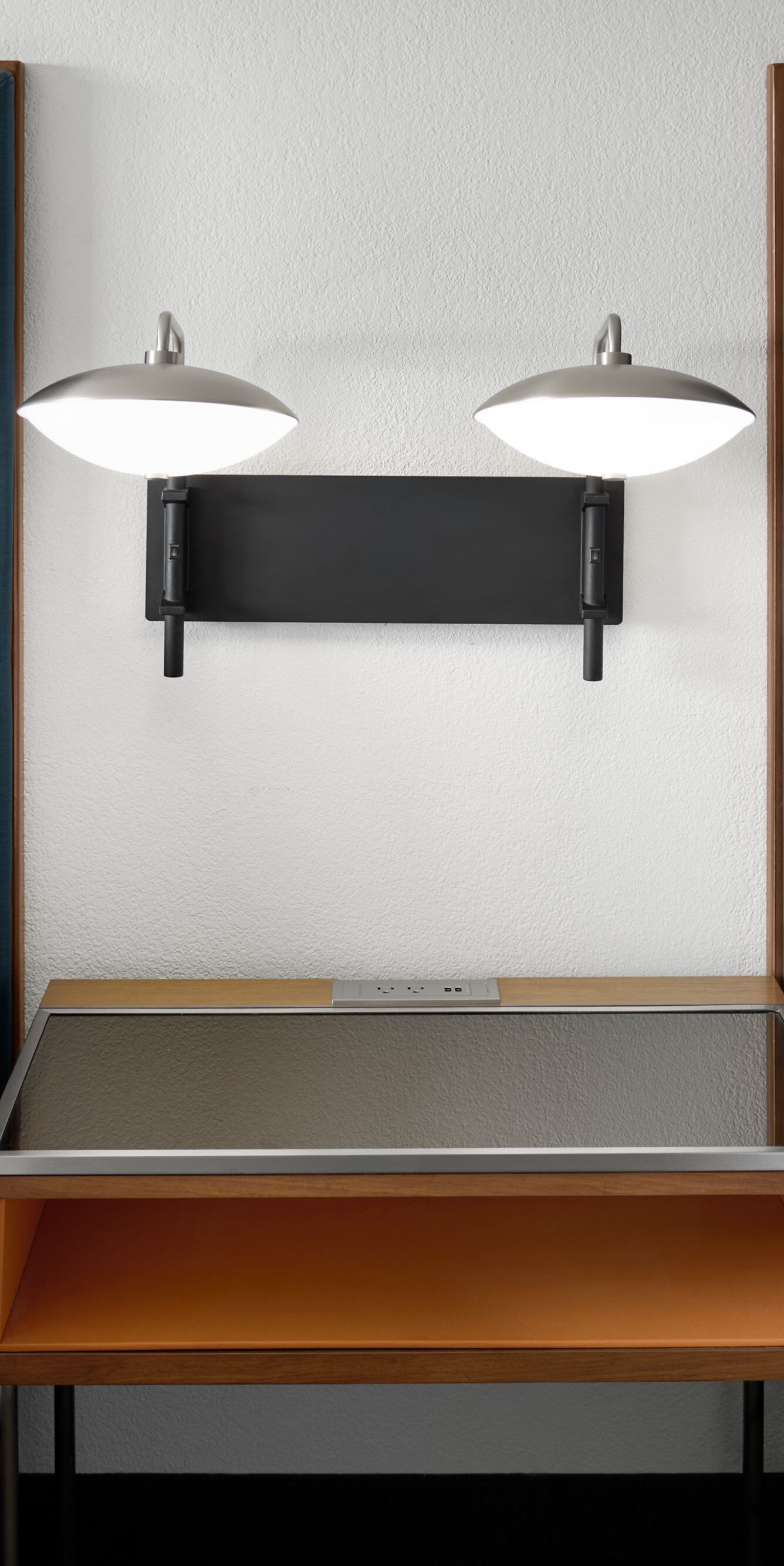 two beds with nightstand between