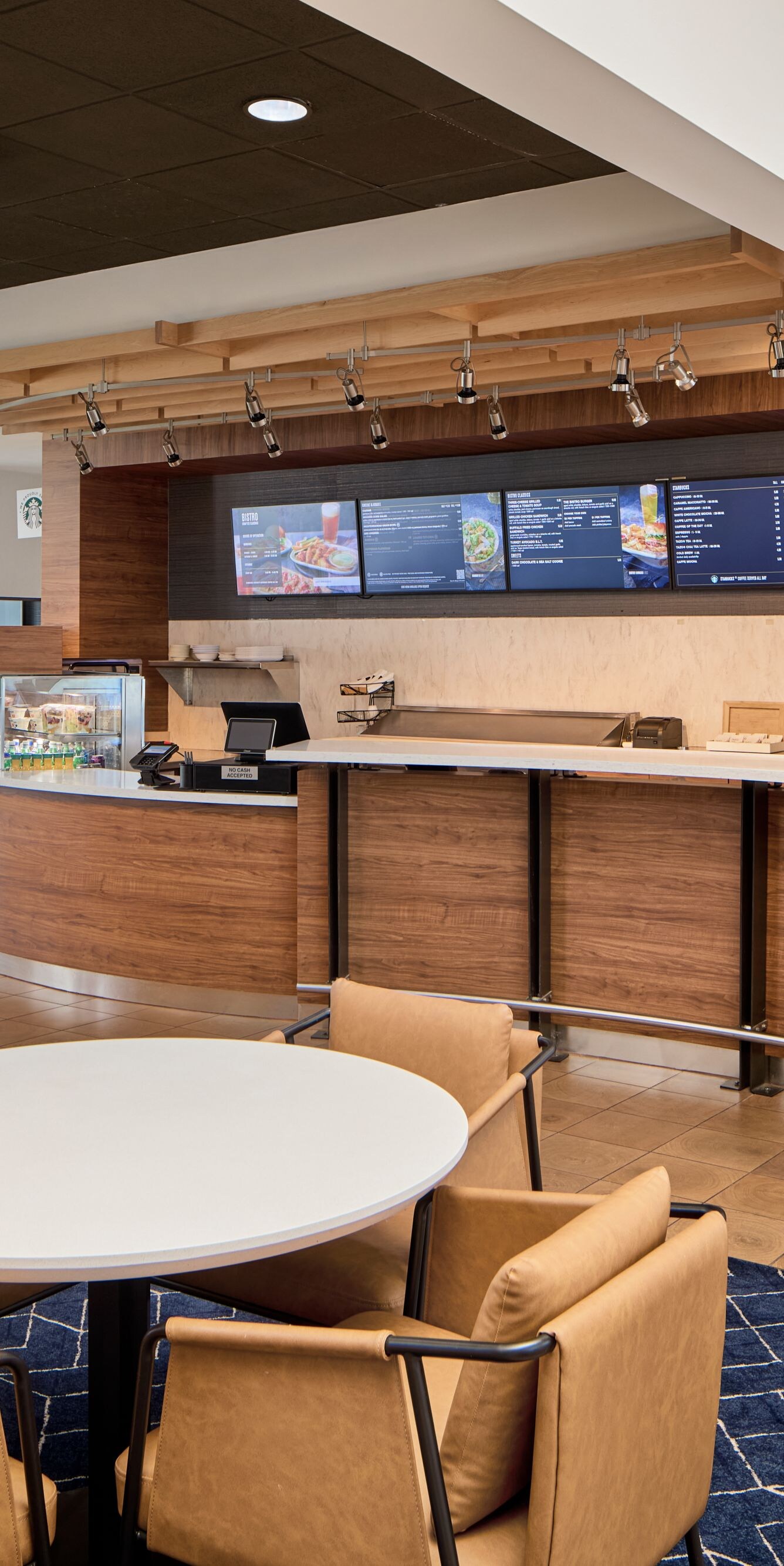 Hotel bistro with seating and beverage bar