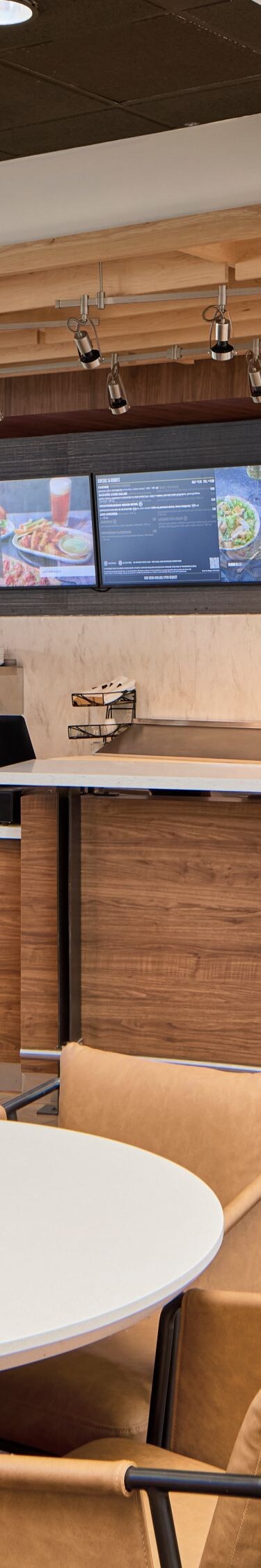 Hotel bistro with seating and beverage bar