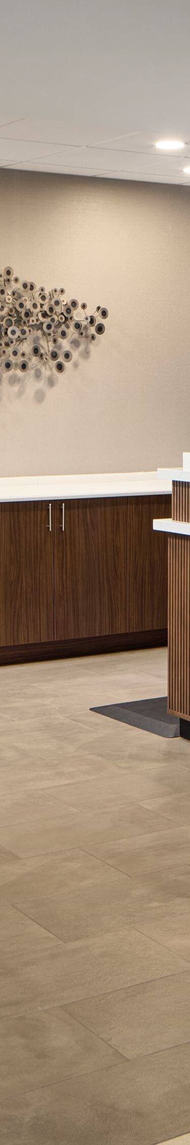 Hotel front desk with seating area nearby