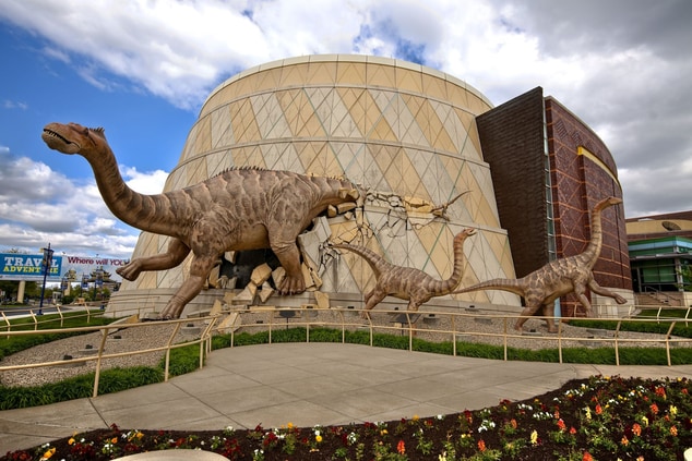 dinosaur sculpture on outside of building