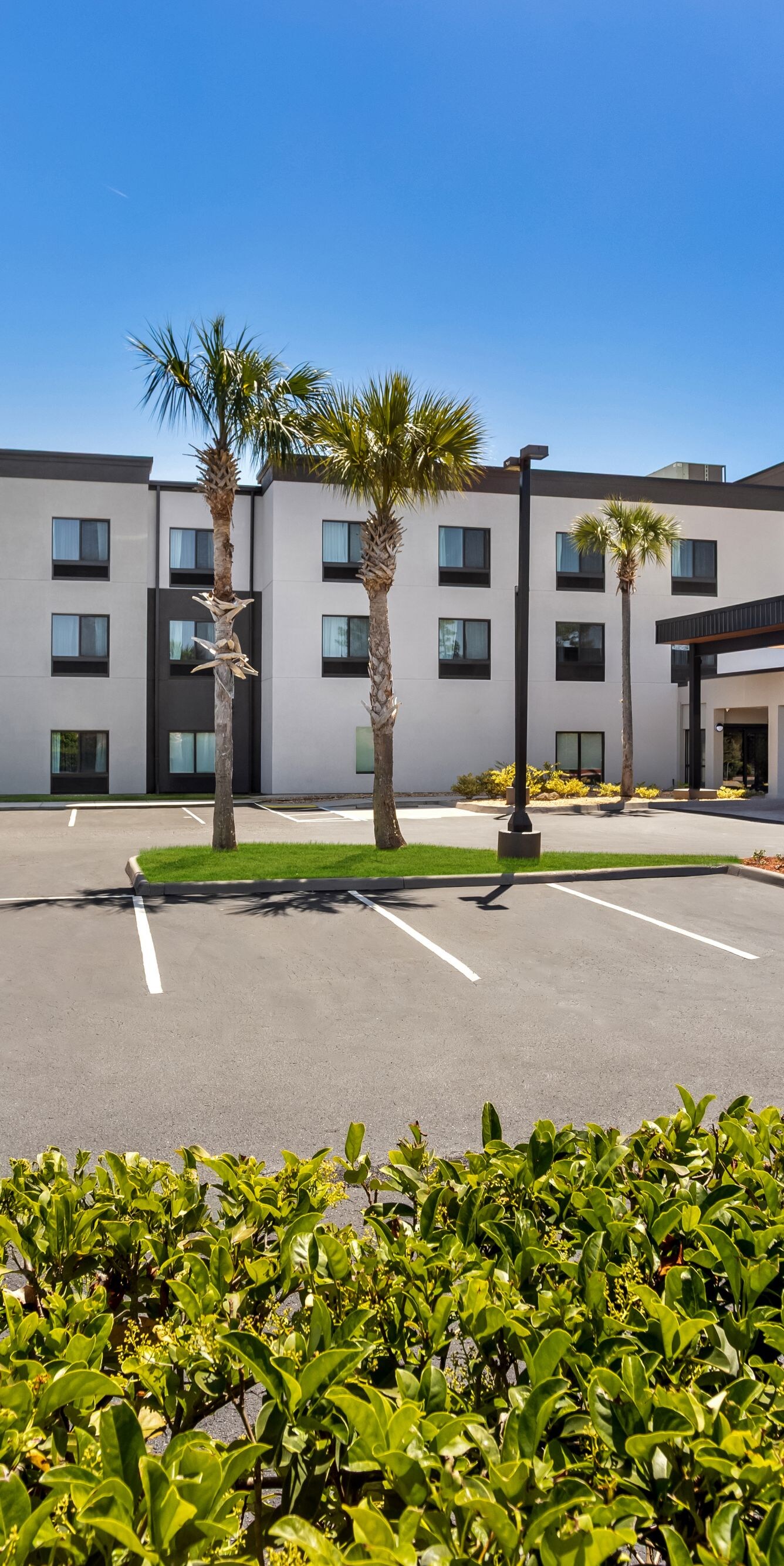 Hotel exterior with covered entrance drive