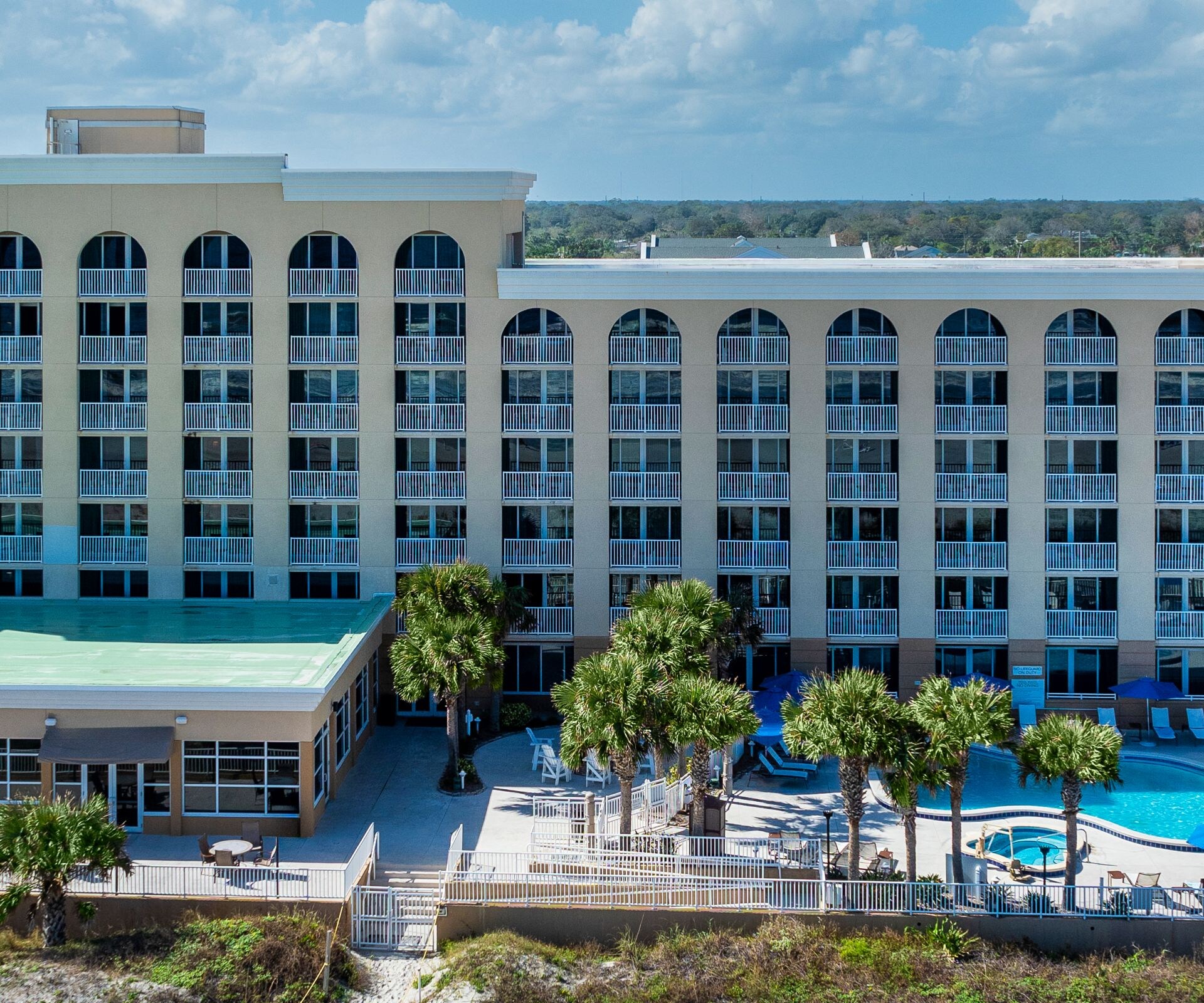 Hotel Exterior and beach at daytime