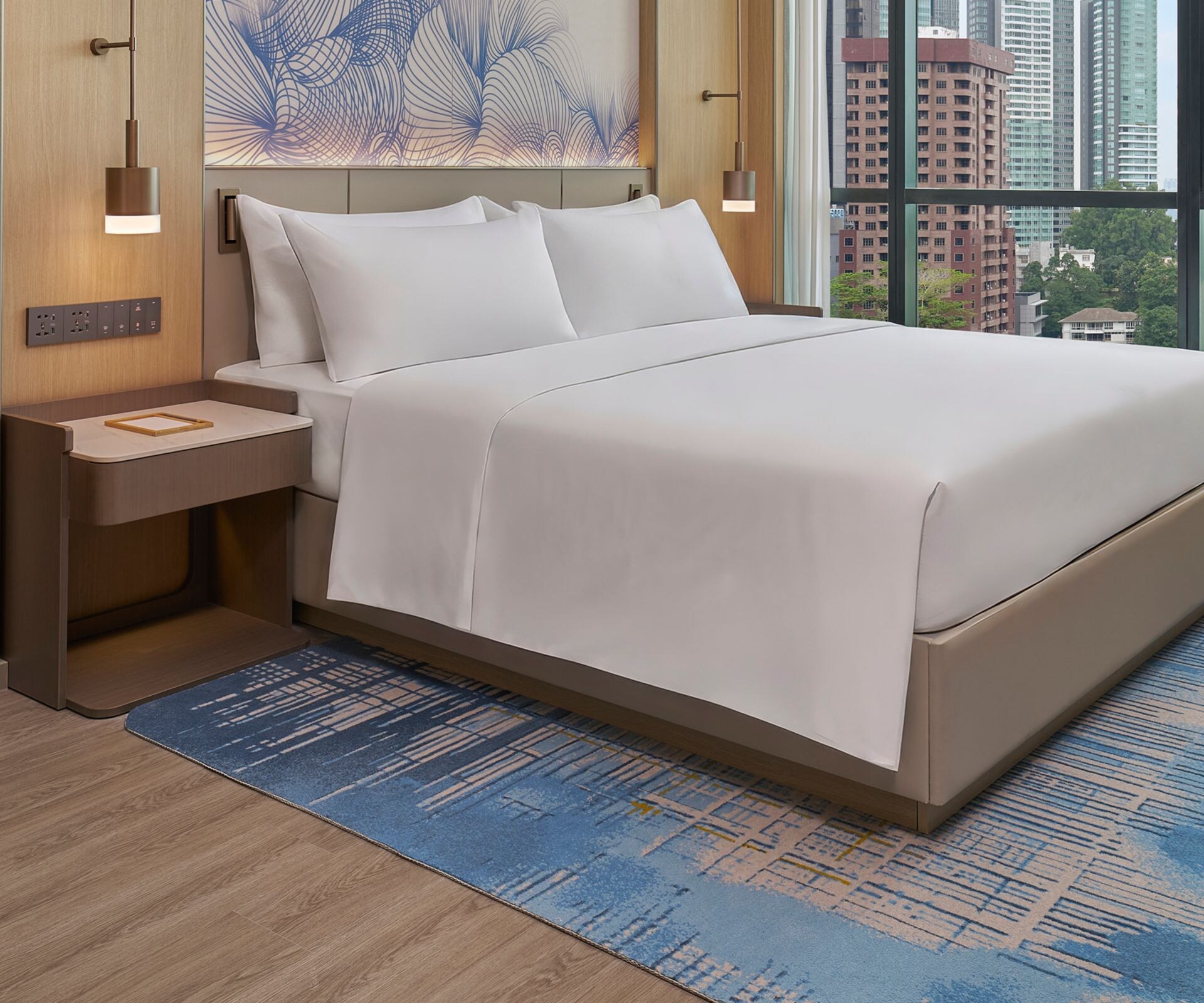 King guest room with city skyline view