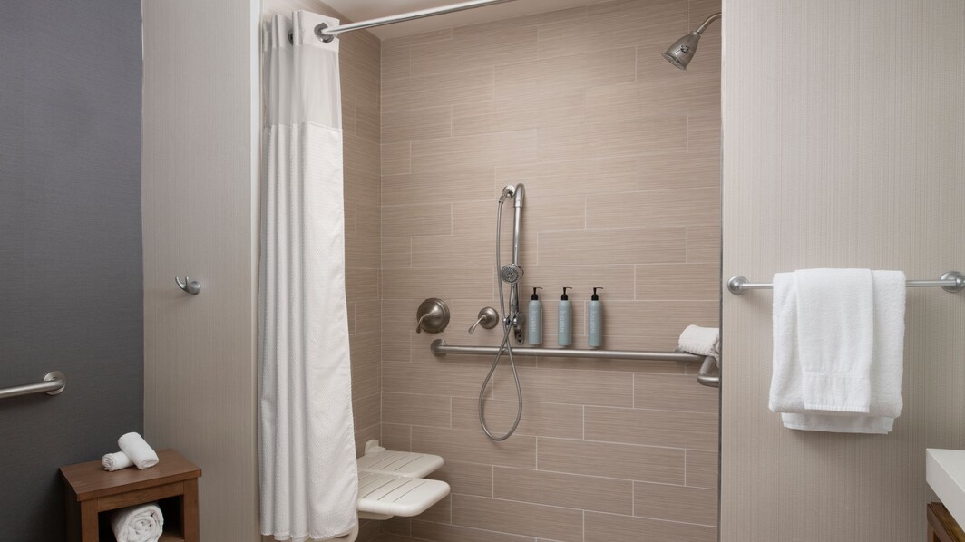 Assessable bathroom featuring a walk-in shower