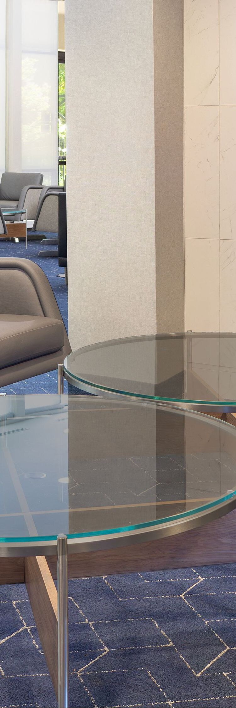 Lobby seating are with chairs and fireplace