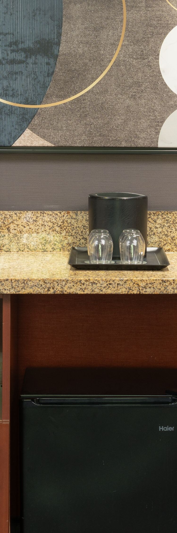 Wet bar featuring a spacious countertop and sink