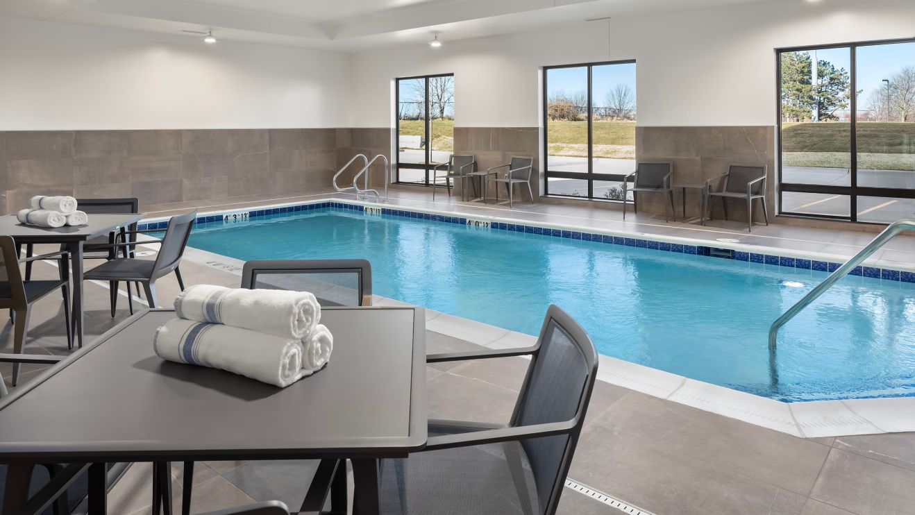 Indoor Pool, chairs, tables, towels