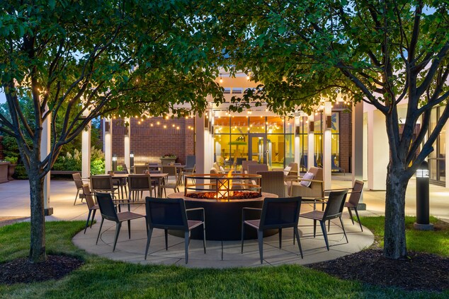 Outdoor courtyard with seating and fireplace