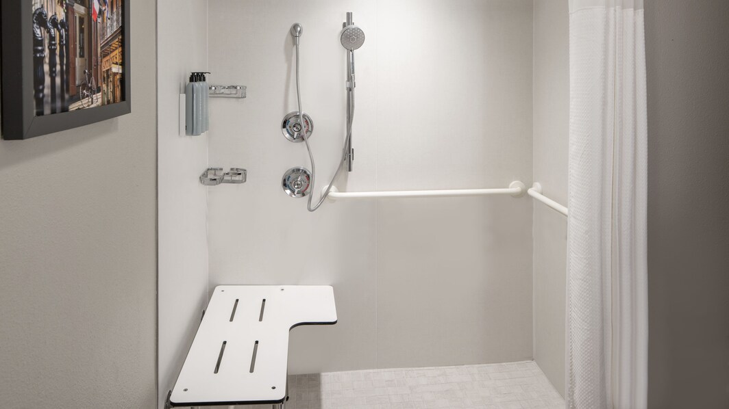 ADA bathroom roll in shower with grab bars