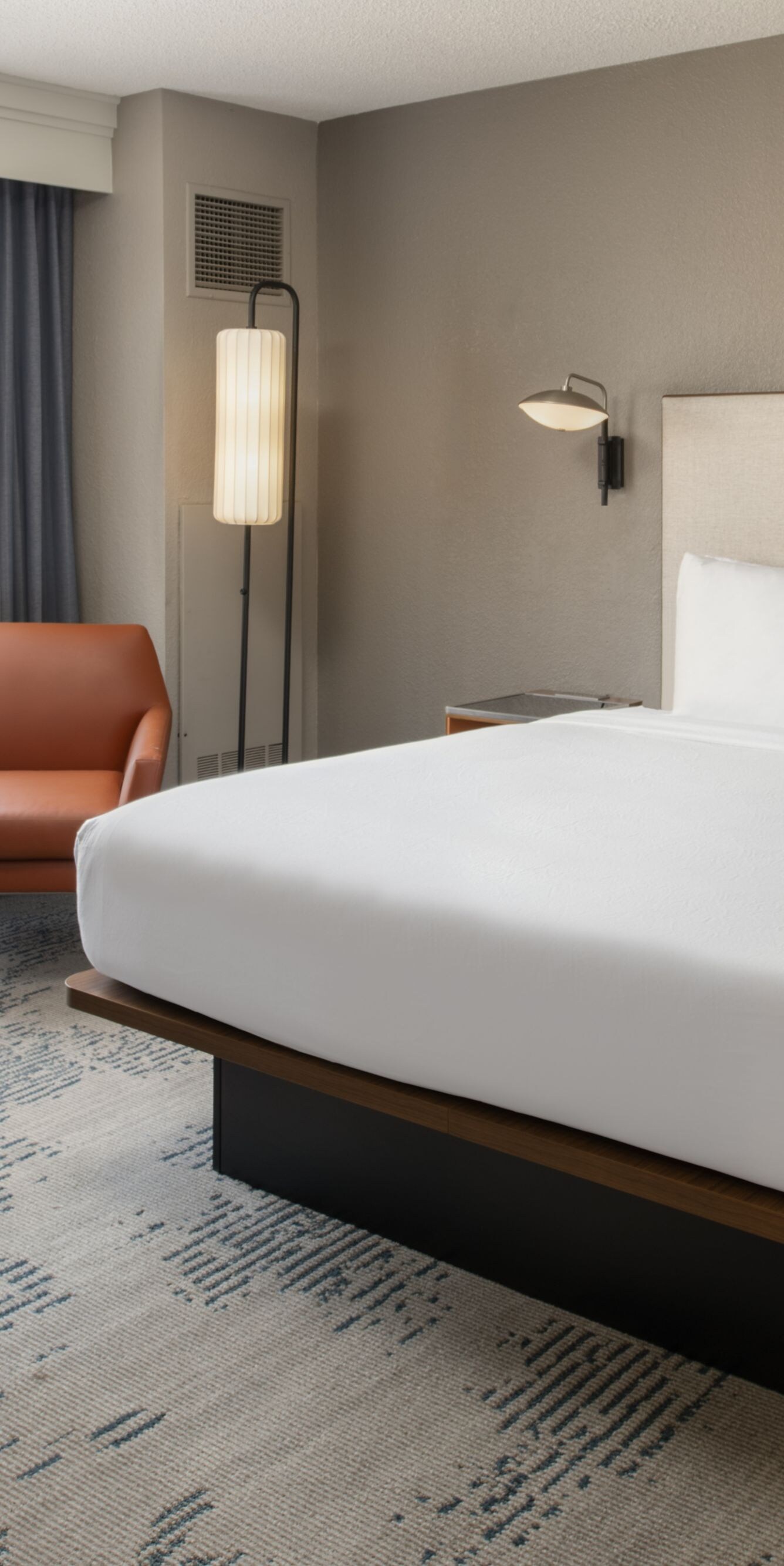 King bed and orange armchair