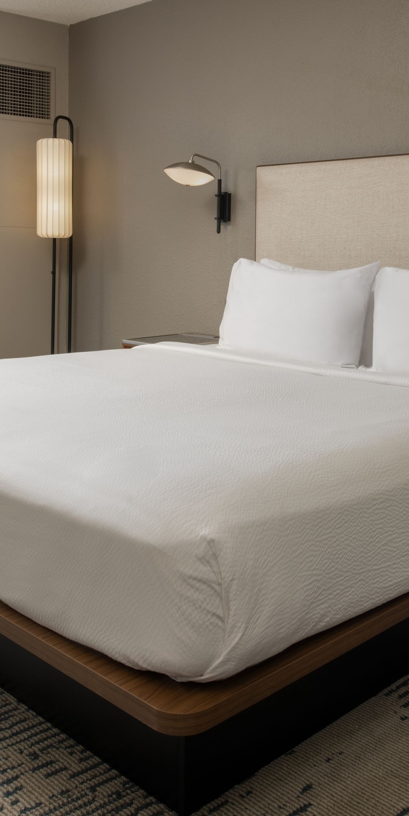 king bed, armchair, small table