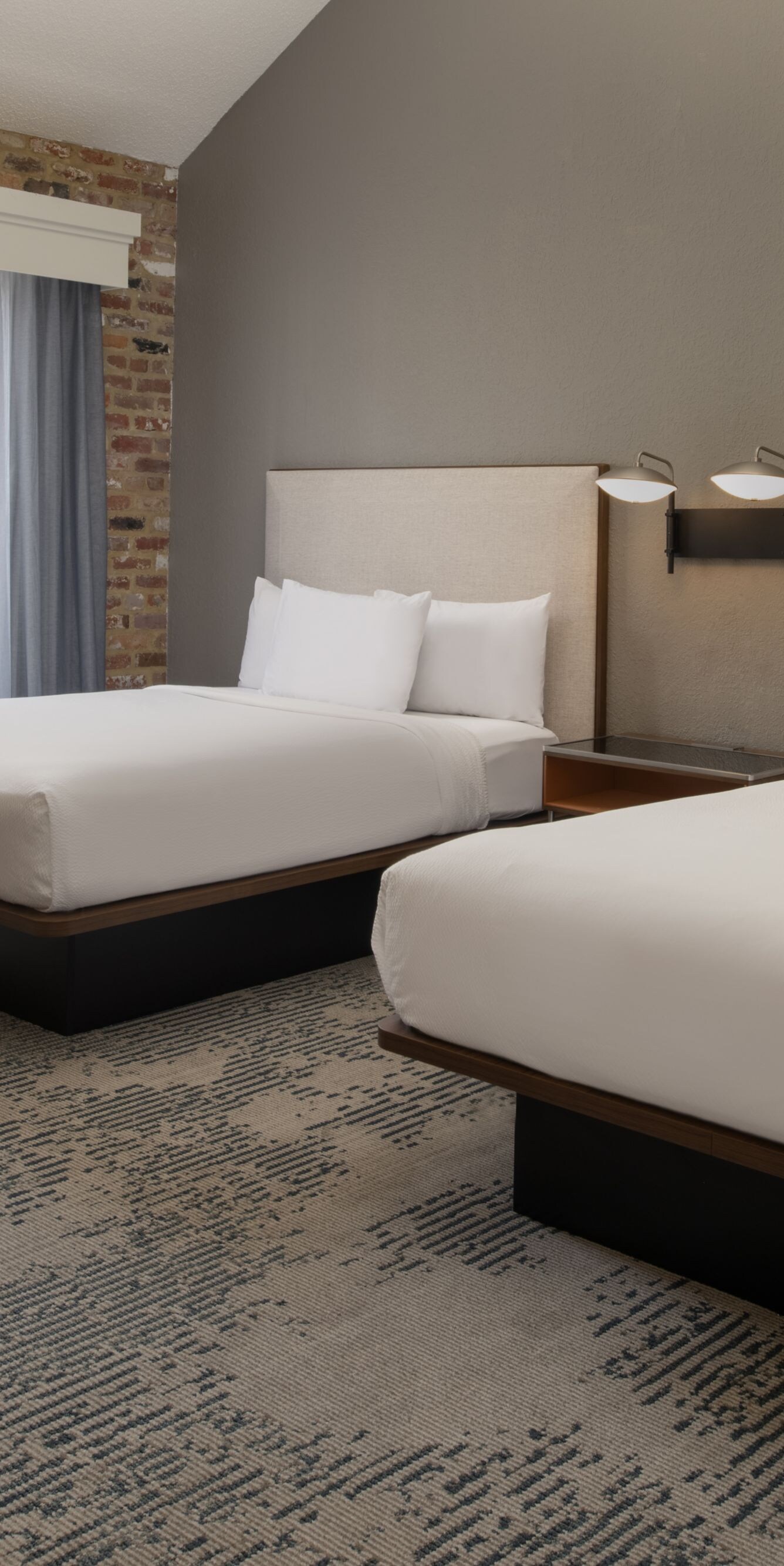 two queen beds, and armchair