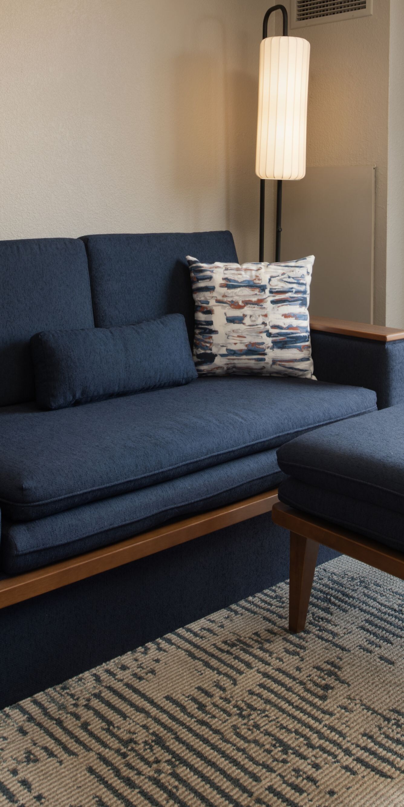 sofa, ottoman, and balcony view