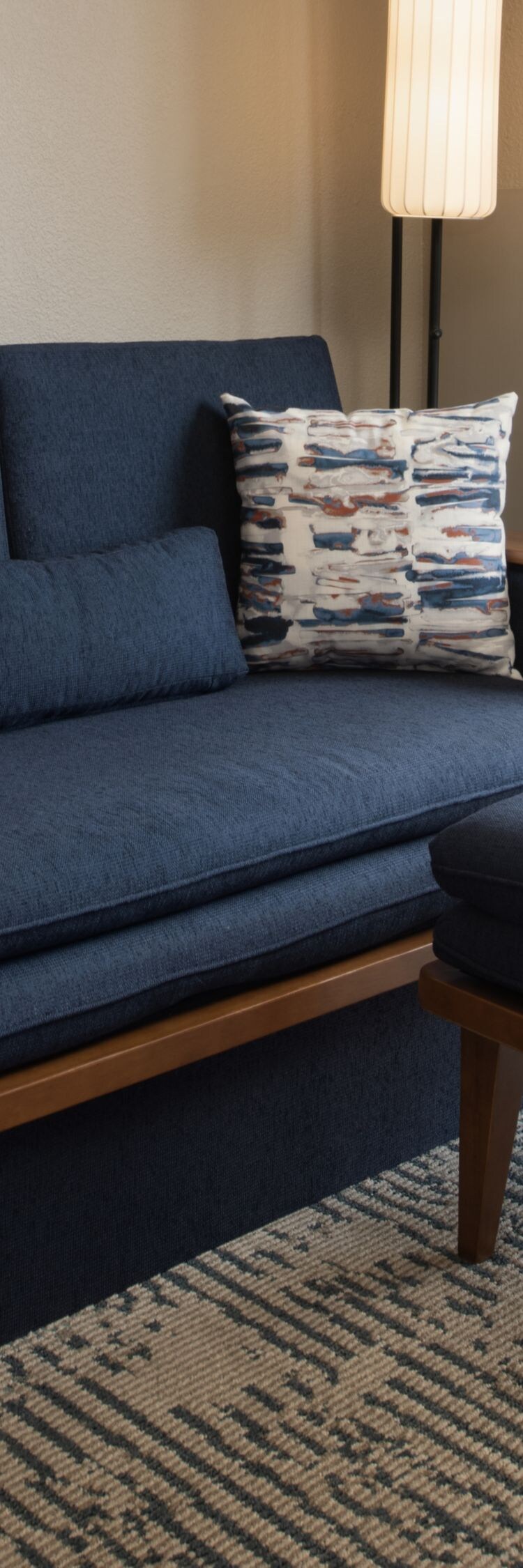 sofa, ottoman, and balcony view