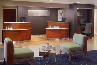 front desk welcome pedestals and seating area