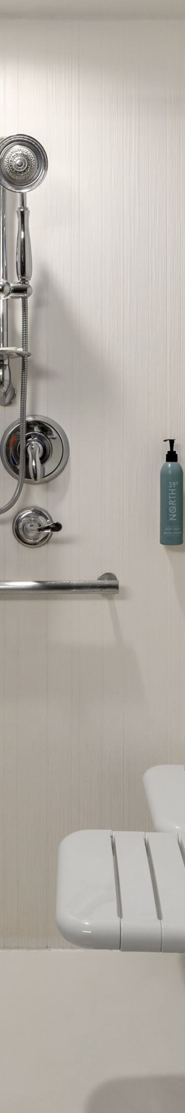 Roll-in shower with grab bars and seat