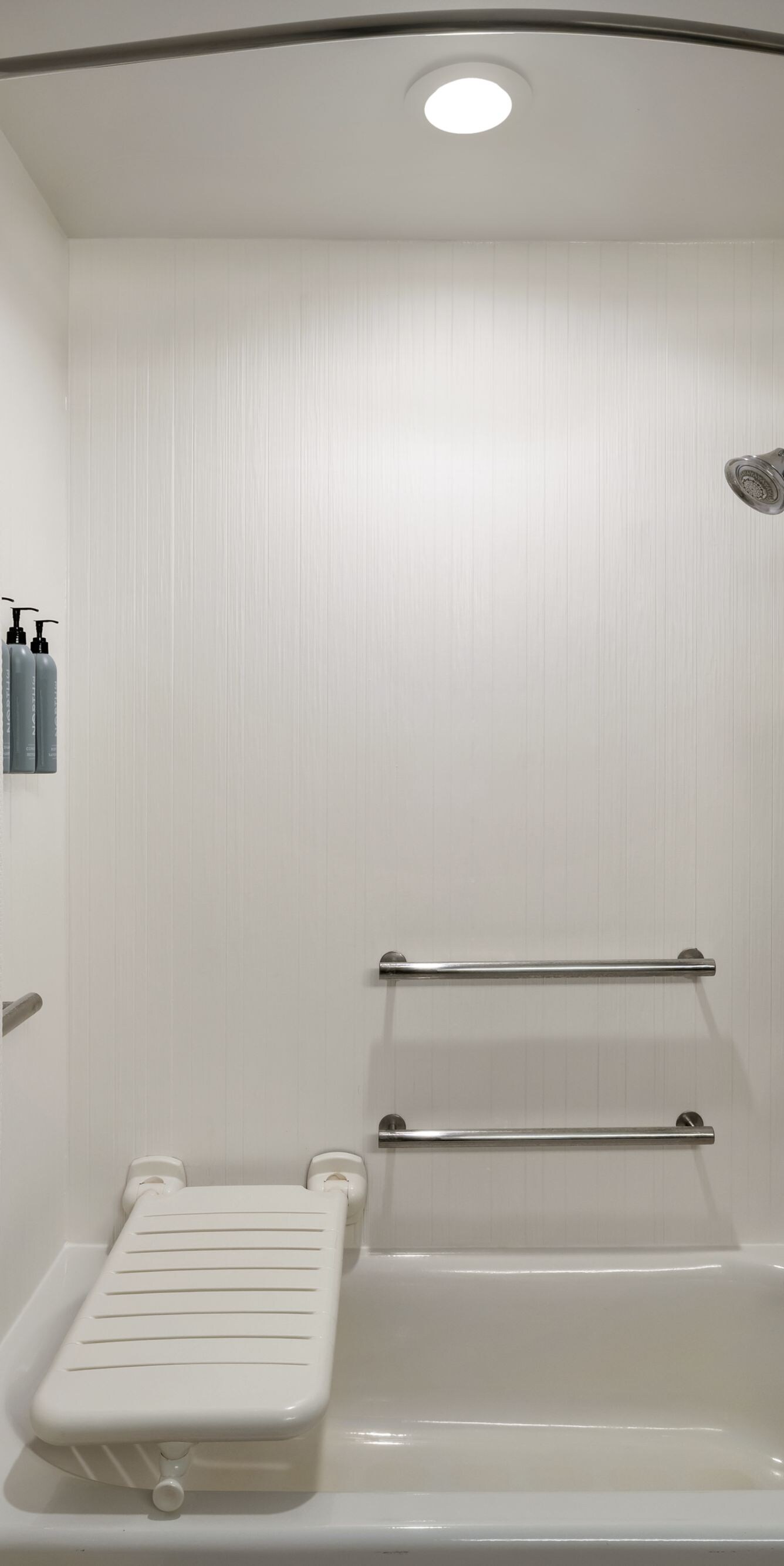 Accessible bathtub with grab bars and seat