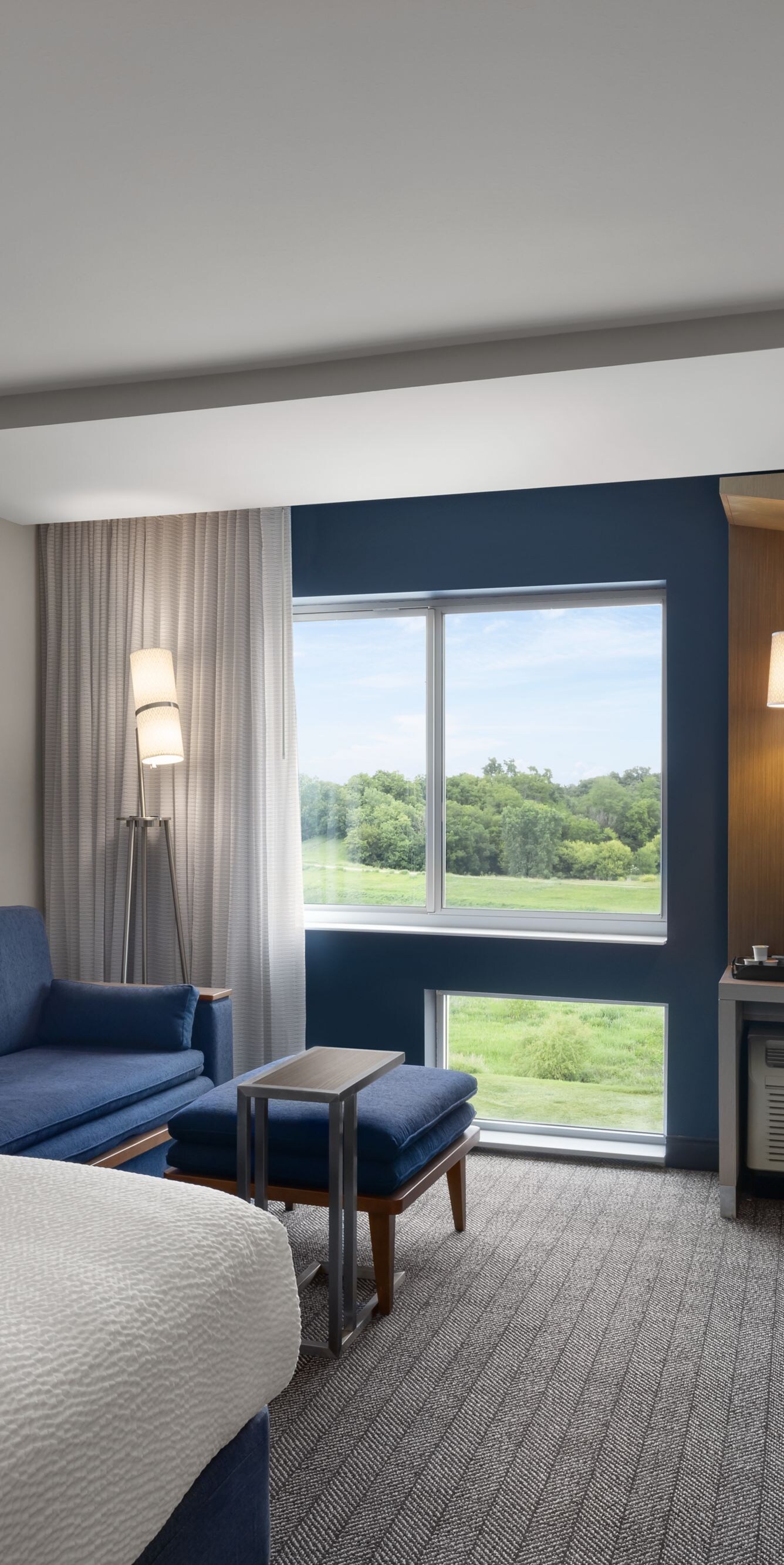 King guest room with sofa and work desk