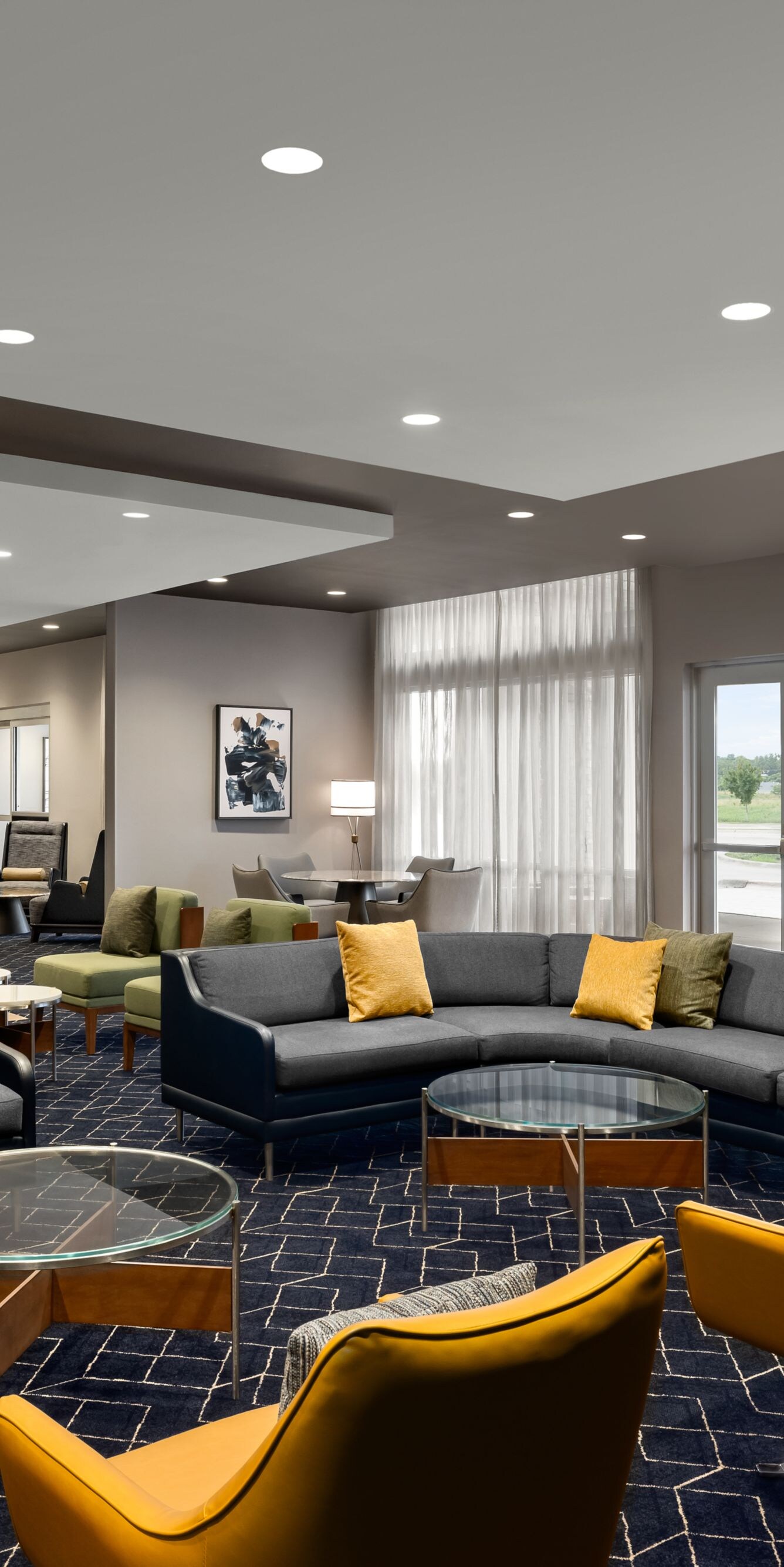 Lobby with sectional sofas and yellow chairs