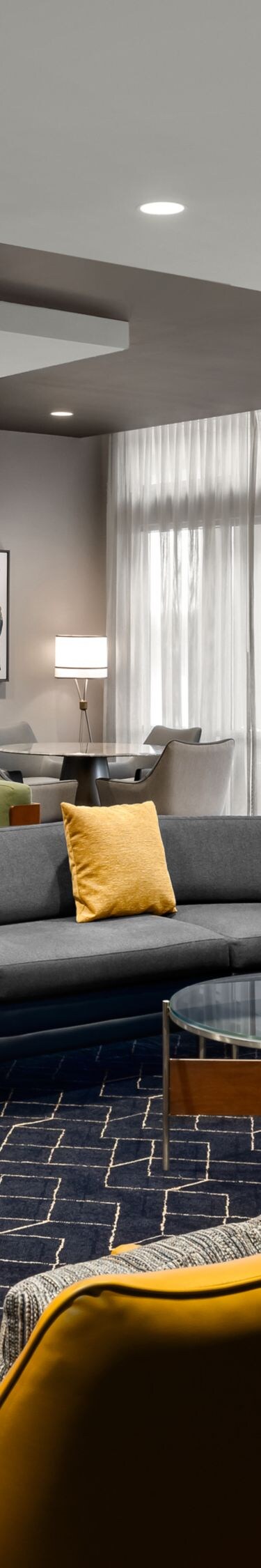 Lobby with sectional sofas and yellow chairs