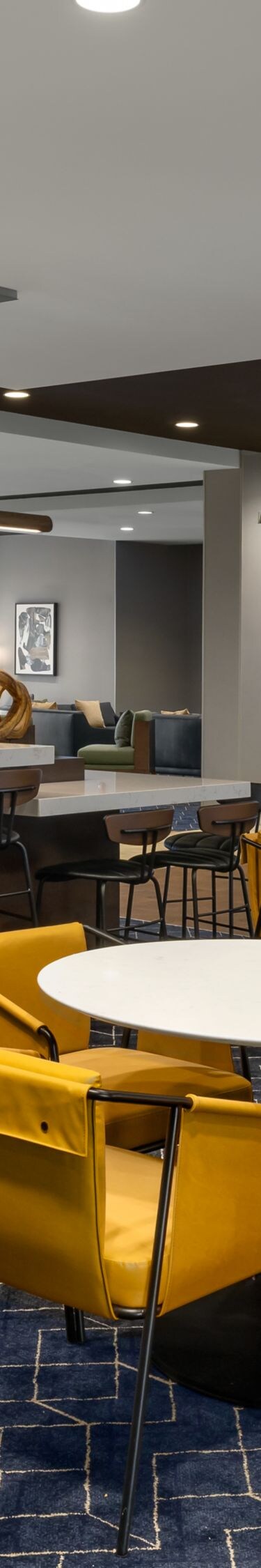 Bistro with yellow chairs and blue carpet