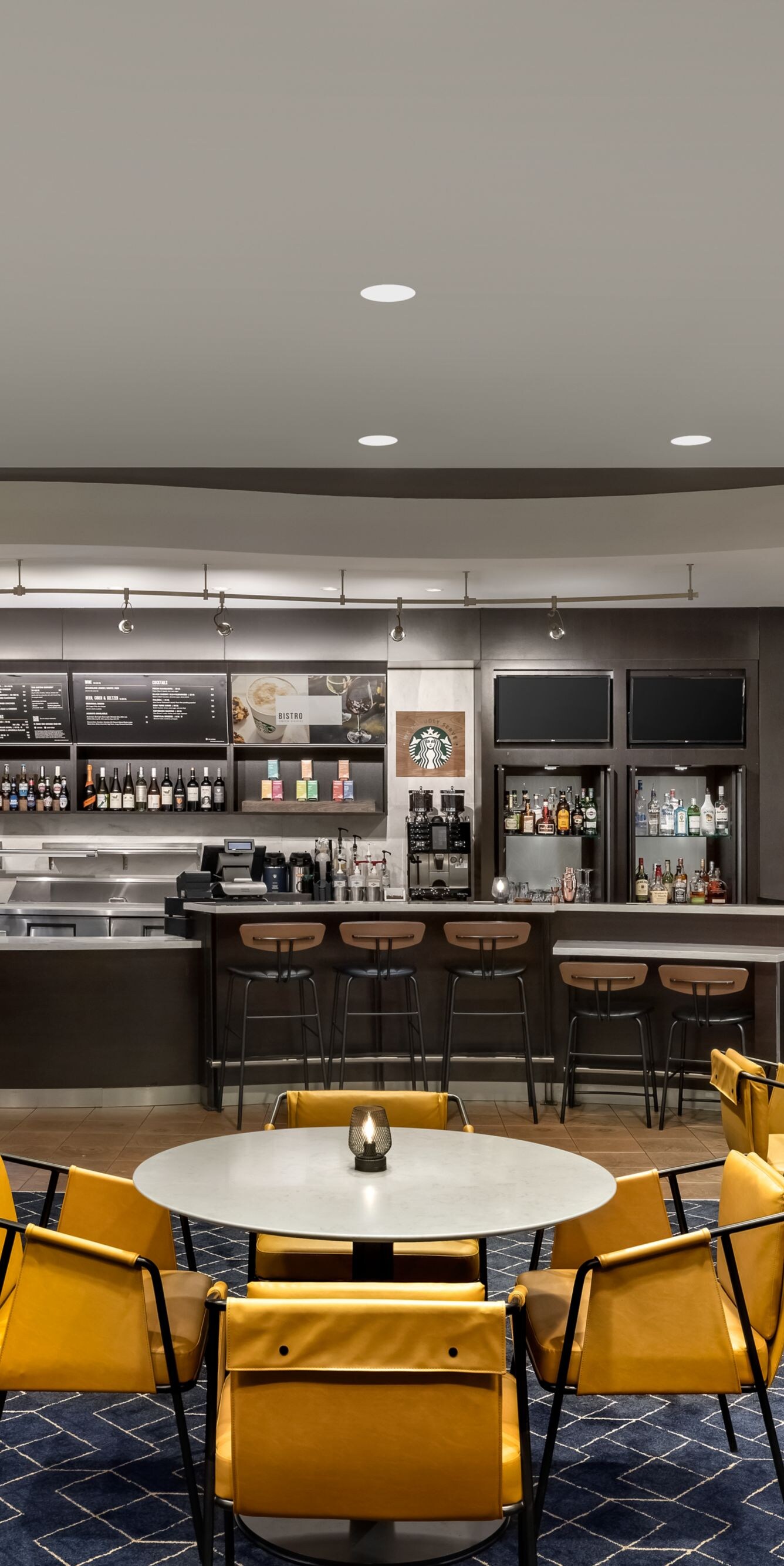Bistro with yellow chairs and bar seating