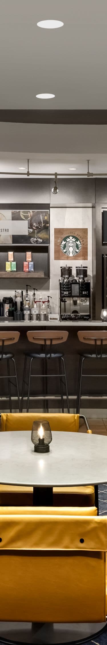 Bistro with yellow chairs and bar seating