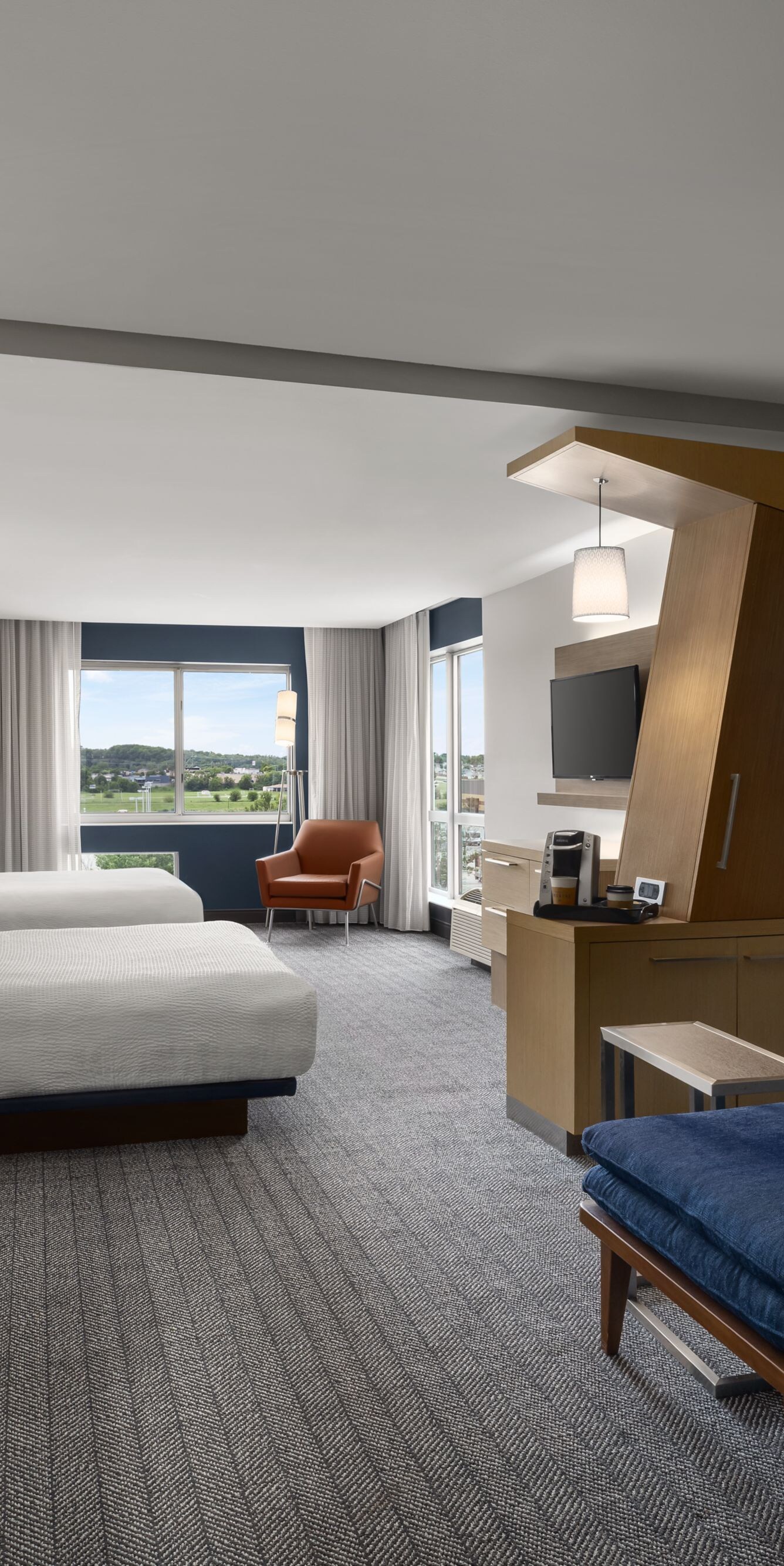 Two queen beds with sofa and work desk