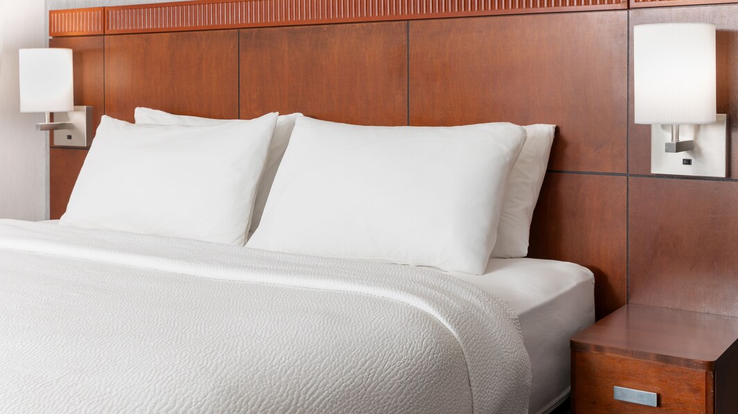 King-sized bed with plush bedding and soft pillows