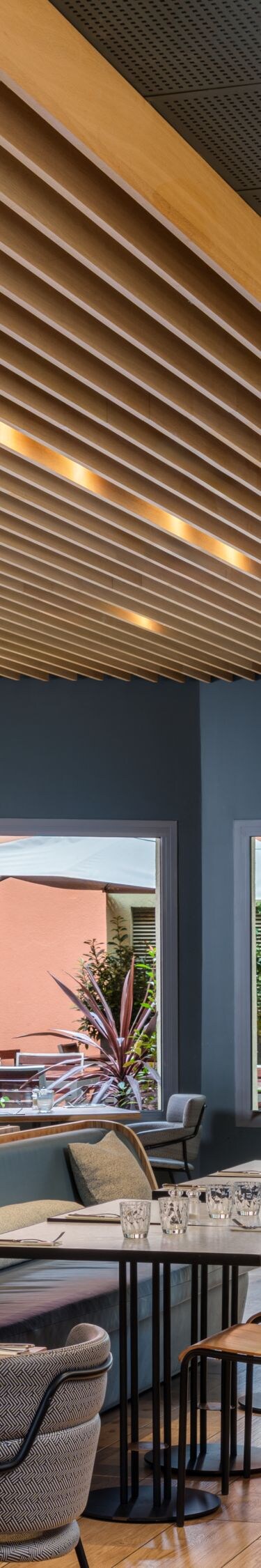 Modern restaurant with wood slat ceiling