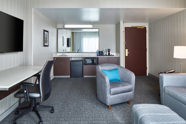Unwind in this spacious suite. The King Suite bedr