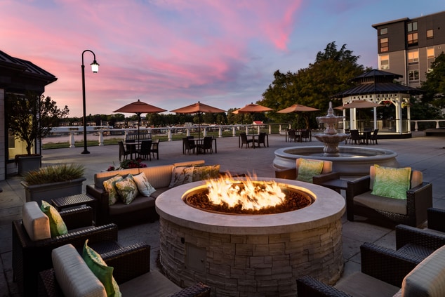 Outdoor seating and firepit at dusk